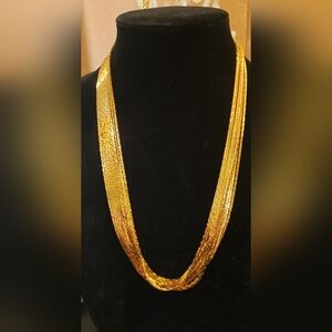 Vintage 1980s costume jewelry multi gold tone chain statement necklace.